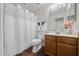 Well-lit bathroom featuring tile floors, a shower with curtain, and a wood vanity at 45 E 9Th Pl # 12, Mesa, AZ 85201