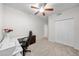 Bright bedroom showcasing neutral carpet, a ceiling fan, and a large closet for optimal storage at 45 E 9Th Pl # 12, Mesa, AZ 85201