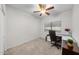 Well-lit bedroom featuring neutral carpet, a ceiling fan, and a bright window at 45 E 9Th Pl # 12, Mesa, AZ 85201