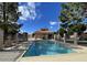 Community pool with pristine blue water, sheltered lounge area, and beautiful Arizona sky at 45 E 9Th Pl # 12, Mesa, AZ 85201