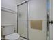 Bathroom stall featuring towel rack, toilet, and sliding glass door at 455 S Delaware Dr # 171, Apache Junction, AZ 85120