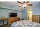 Bedroom with wood-look floors, ceiling fan, furniture, and en-suite bathroom at 455 S Delaware Dr # 171, Apache Junction, AZ 85120