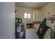 A laundry room features a hot water tank, washer, dryer, and shelving at 455 S Delaware Dr # 171, Apache Junction, AZ 85120