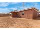 Backyard view showing a window, covered patio and a brick perimeter wall at 4601 S 21St St, Phoenix, AZ 85040