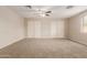 Spacious bedroom features carpet, ceiling fan, and large closets at 4601 S 21St St, Phoenix, AZ 85040