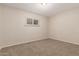 Neutral bedroom showing carpet, paint, baseboards, and window with blinds at 4601 S 21St St, Phoenix, AZ 85040