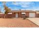 Charming single-story home with white trim, desert landscaping, and awnings at 4601 S 21St St, Phoenix, AZ 85040