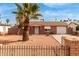 Charming single-story home with well-maintained desert landscaping and a brick fence at 4601 S 21St St, Phoenix, AZ 85040