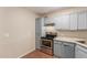 A view of kitchen featuring stainless steel oven and light blue cabinets at 4601 S 21St St, Phoenix, AZ 85040