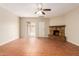 A well-lit living room includes tiled floors and a stone fireplace at 4601 S 21St St, Phoenix, AZ 85040