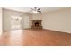 Living room features tiled floors, a ceiling fan, and a stone fireplace at 4601 S 21St St, Phoenix, AZ 85040