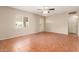 A bright living room features tiled floors, a ceiling fan, and neutral walls at 4601 S 21St St, Phoenix, AZ 85040