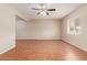 Spacious living room featuring tile flooring, ceiling fan, and bright natural light at 4601 S 21St St, Phoenix, AZ 85040