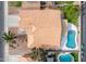 Aerial view of a home with a private backyard pool, tile roof, and low-maintenance landscaping at 474 W Smoke Tree Rd, Gilbert, AZ 85233