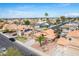 A suburban neighborhood showcasing well-maintained homes under a partly cloudy sky at 474 W Smoke Tree Rd, Gilbert, AZ 85233