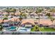 Neighborhood aerial view showcasing a desirable community and well-maintained homes with private pools and lush landscaping at 474 W Smoke Tree Rd, Gilbert, AZ 85233