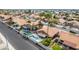 Aerial view of homes with private pools and manicured lawns in a suburban setting at 474 W Smoke Tree Rd, Gilbert, AZ 85233