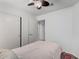 Bedroom with closet doors and a view of the ceiling fan at 474 W Smoke Tree Rd, Gilbert, AZ 85233