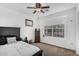 Bright bedroom with a ceiling fan and window view at 474 W Smoke Tree Rd, Gilbert, AZ 85233