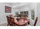 Elegant dining room with a decorative chandelier and large windows overlooking the yard at 474 W Smoke Tree Rd, Gilbert, AZ 85233