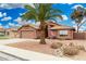 Single-Gathering home with desert landscaping, featuring a two-car garage and flagpole at 474 W Smoke Tree Rd, Gilbert, AZ 85233