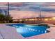 Backyard pool with integrated spa and lighting, set against a block wall with tasteful string lights at 474 W Smoke Tree Rd, Gilbert, AZ 85233