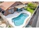 Aerial view of a private pool with a covered patio and outdoor seating area at 474 W Smoke Tree Rd, Gilbert, AZ 85233