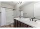 Well-lit bathroom with a double sink vanity, modern fixtures, and a shower-tub combination at 5513 S Coyote Cyn, Mesa, AZ 85212