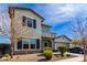 Charming two-story home with a well-manicured front yard and a two car garage on a sunny day at 5513 S Coyote Cyn, Mesa, AZ 85212