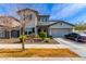 Charming two-story home with a well-manicured front yard and a two car garage on a sunny day at 5513 S Coyote Cyn, Mesa, AZ 85212