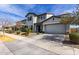 Charming two-story home with a two-car garage, desert landscaping, and a covered front entryway at 5513 S Coyote Cyn, Mesa, AZ 85212