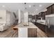 Spacious kitchen with an oversized island and stainless steel appliances and pendant lighting at 5513 S Coyote Cyn, Mesa, AZ 85212