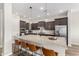 Kitchen with a large island providing barstool seating and stainless steel appliances at 5513 S Coyote Cyn, Mesa, AZ 85212