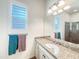 Bathroom featuring vanity with granite countertop, modern lighting, and a framed mirror at 6039 E Sienna Bouquet Pl, Cave Creek, AZ 85331