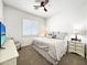 Comfortable bedroom features neutral carpet, ceiling fan, and white plantation shutters for added privacy at 6039 E Sienna Bouquet Pl, Cave Creek, AZ 85331