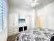 Bedroom featuring a ceiling fan and a built in wardrobe with flatscreen TV above at 6039 E Sienna Bouquet Pl, Cave Creek, AZ 85331