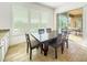 Bright dining room featuring a wood table with six chairs and sliding door access to the patio at 6039 E Sienna Bouquet Pl, Cave Creek, AZ 85331