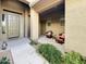 Covered front porch with seating area and desert landscaping at 6039 E Sienna Bouquet Pl, Cave Creek, AZ 85331