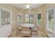 Cozy breakfast nook with a round table, four chairs, and a view of the backyard at 617 S Palo Verde Way, Mesa, AZ 85208