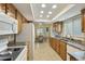 Kitchen featuring a breakfast nook, tile floors, wood cabinets, and recessed lighting at 617 S Palo Verde Way, Mesa, AZ 85208