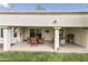 Spacious covered patio features a seating area, an outdoor kitchen, and views of the backyard at 617 S Palo Verde Way, Mesa, AZ 85208