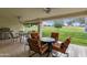 Covered patio featuring comfortable seating, a ceiling fan, and a golf course view at 617 S Palo Verde Way, Mesa, AZ 85208