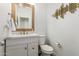 Stylish powder room featuring modern fixtures, textured walls and tasteful decor at 6208 N 78Th Dr, Glendale, AZ 85303