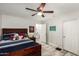 bedroom with wood look floors, natural light, and ensuite at 6208 N 78Th Dr, Glendale, AZ 85303