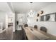 Inviting dining area with statement lighting, modern decor, and neutral tones at 6208 N 78Th Dr, Glendale, AZ 85303