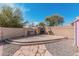 Backyard with stone pavers and fireplace for relaxation and gatherings at 6208 N 78Th Dr, Glendale, AZ 85303