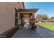 Covered patio with outdoor fan, offering backyard views and a relaxing space at 6208 N 78Th Dr, Glendale, AZ 85303