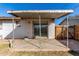 Covered back patio with a concrete floor and sliding glass doors to the house at 658 S Sycamore St # Value, Mesa, AZ 85202