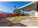 Backyard area with covered patio, lawn, block fence, and foliage at 658 S Sycamore St # Value, Mesa, AZ 85202