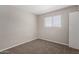 This bedroom offers a window for natural light and a closet for storage at 658 S Sycamore St # Value, Mesa, AZ 85202